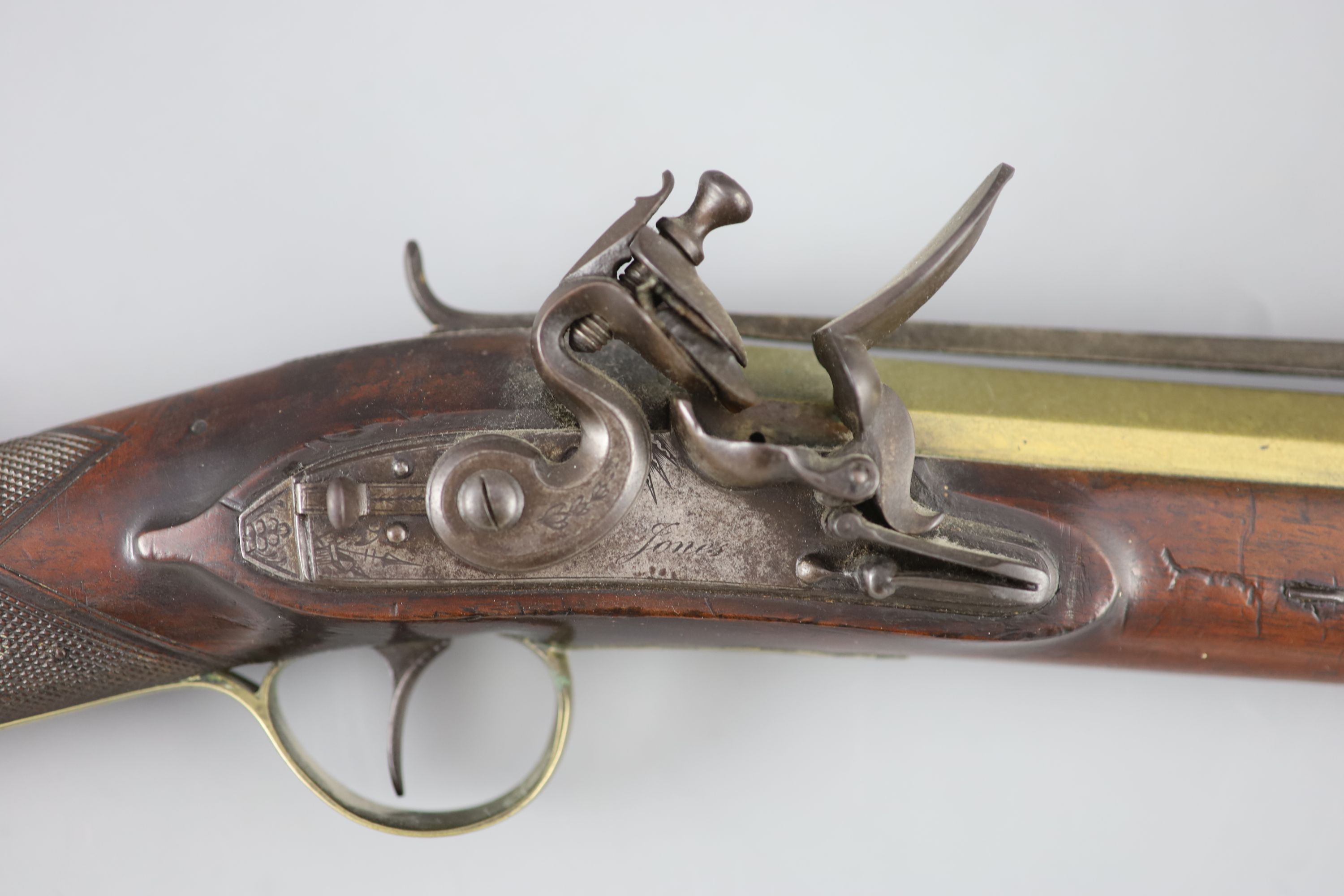 A late 18th century brass barrelled flintlock blunderbuss, by Jones, length 30in.